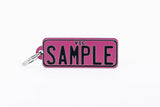 Number Plate Key Ring Pink with Black Writing